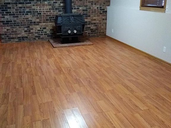 Large lower level family room with a fireplace