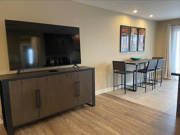 Big screen TV and view to dining