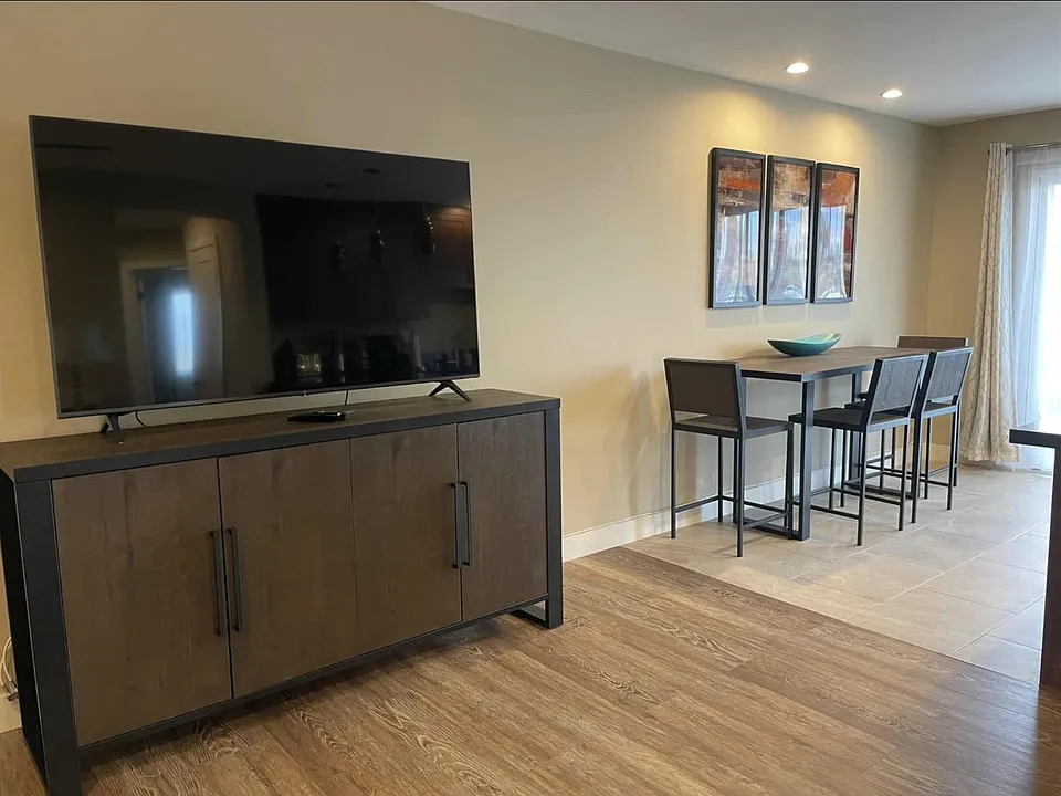 Big screen TV and view to dining