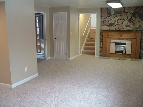Large family room with new paint and carpet