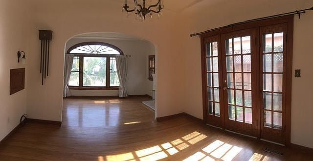 Dining room with French Doors/ Sunrise window of living room