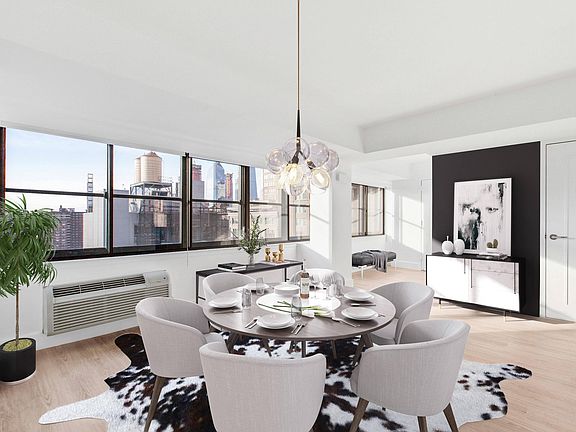 Dining room with city view through large windows