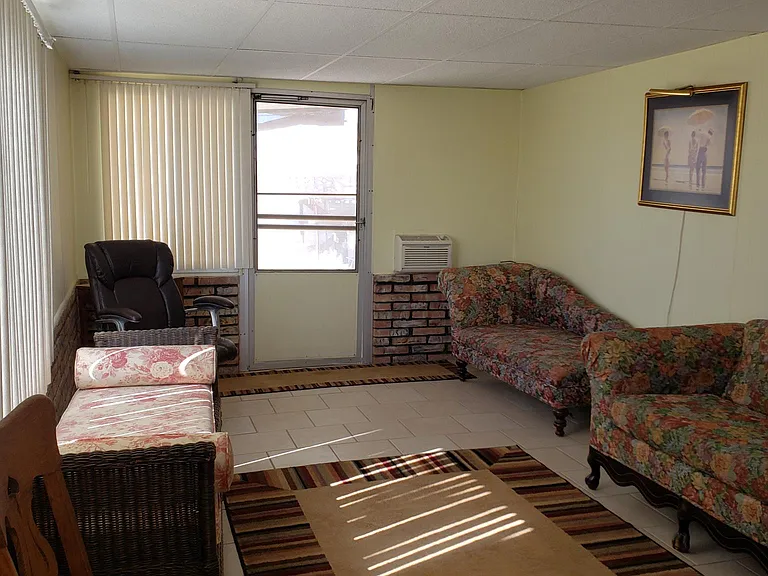 Sunroom, exits to back patio.