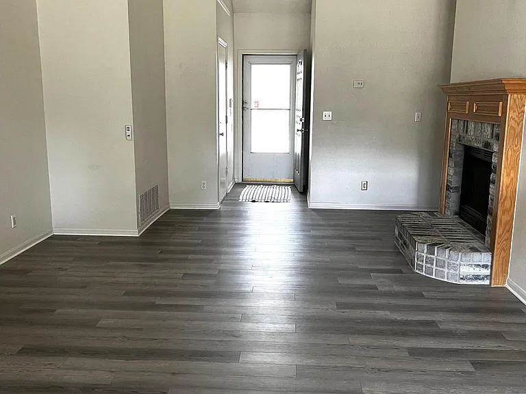 VIEW FROM BACK DOOR TO LIVING ROOM & FRONT DOOR