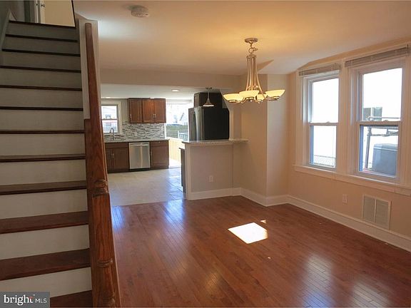 Open concept first floor - dining area, breakfast bar, kitchen