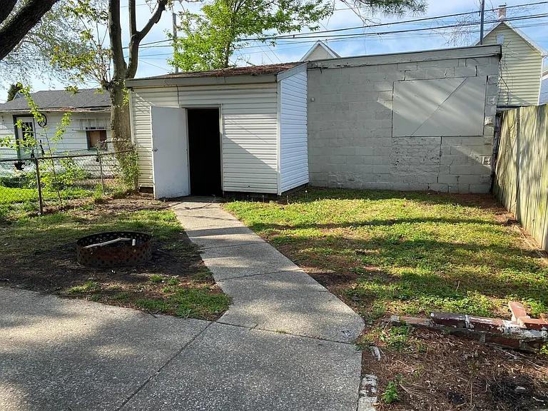 Back yard has concrete patio for all your outdoor activities. Extra large 1 car garage with seperate room for storage or extra living space.