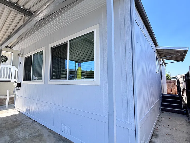 The exterior of this well-maintained mobile home offers both charm and functionality. Featuring durable siding and a clean, inviting facade, the home presents excellent curb appeal.