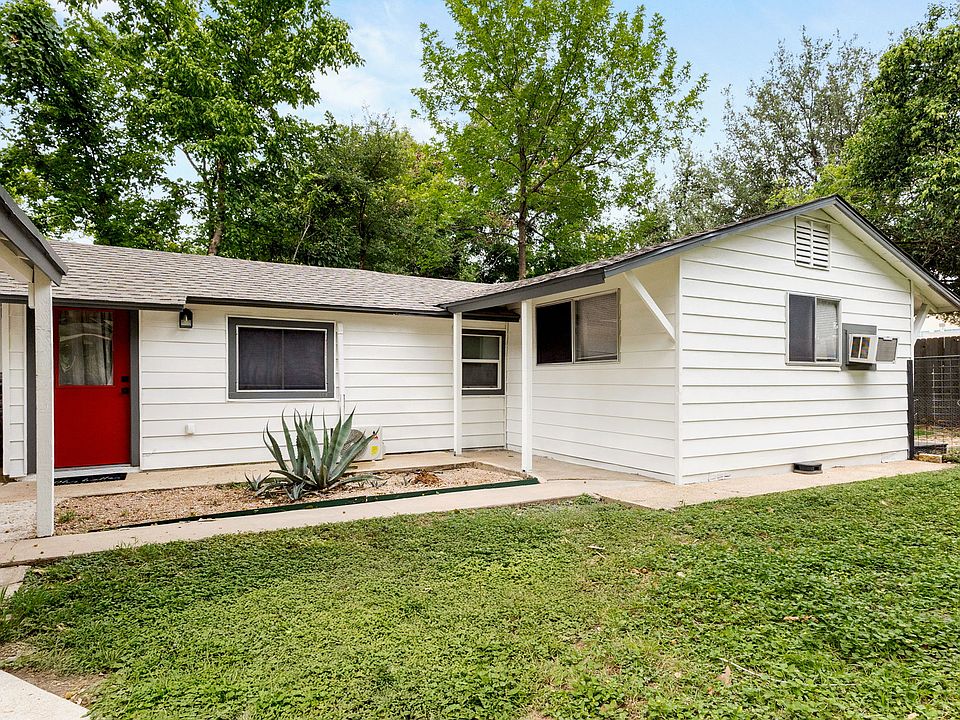 Unit B front door with view of shared and private backyard