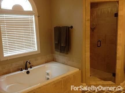 Master bath with Tiled floors
						:
						Features large Jetted tub and beautifully oversized tile shower
