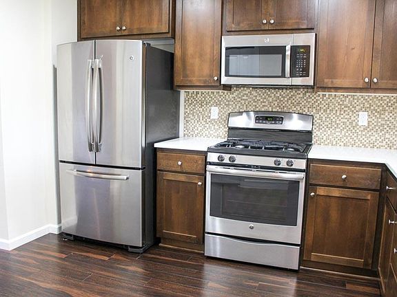 Kitchen with Stainless Steel Appliances & Quartz Counter-top