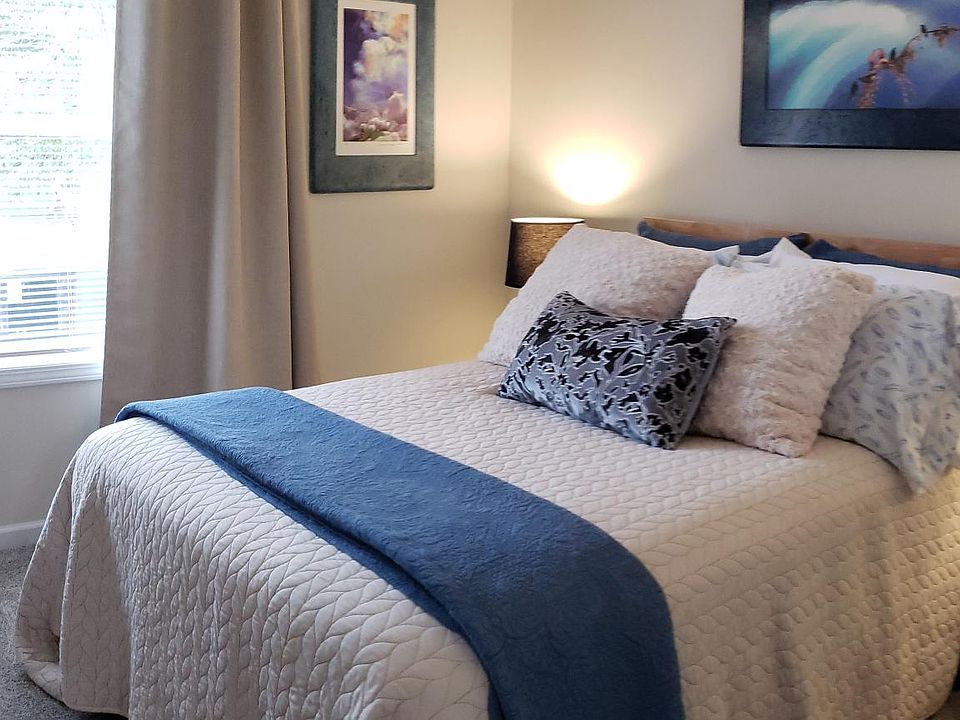 Full size bedroom - plush mattress & linens, custom artwork.