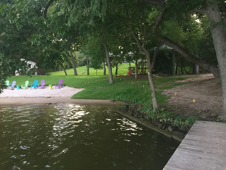 Private easement to the river w/ a small amount of beach a pier and 50ft wide access.