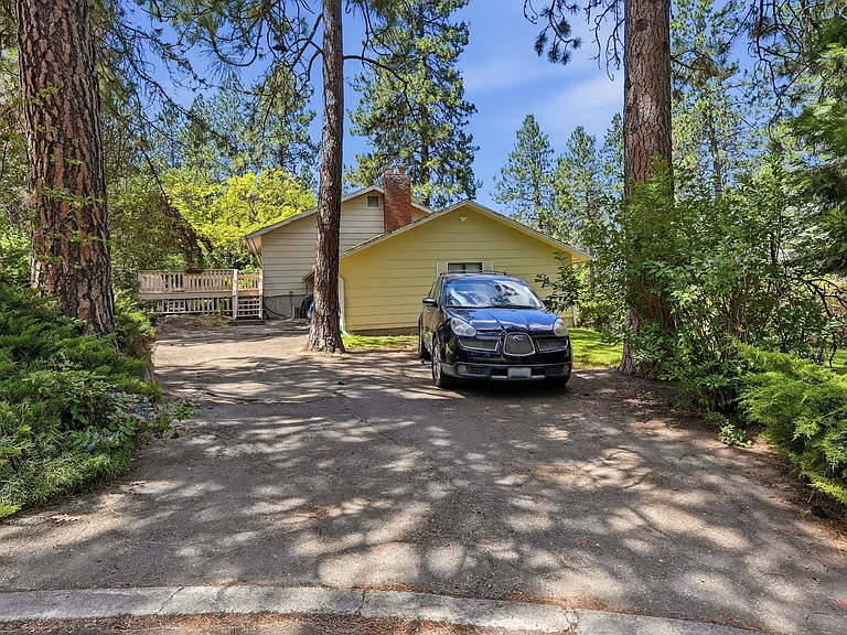 2nd driveway off cul-de-sac at rear side of property