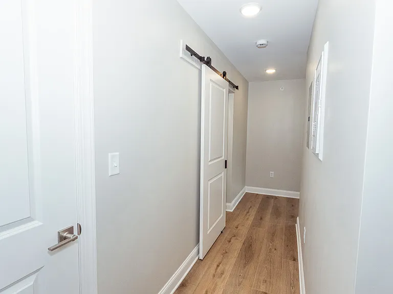 view of the hallways going towards living room from bathroom.