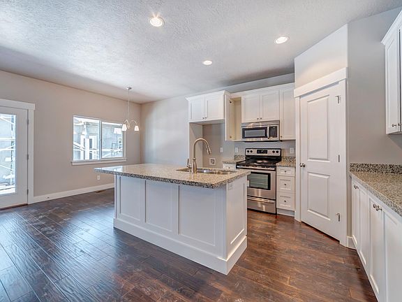 Beautiful kitchen and dining with granite countertops