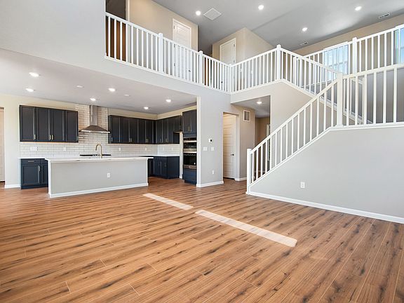 View from great room to kitchen and stairway