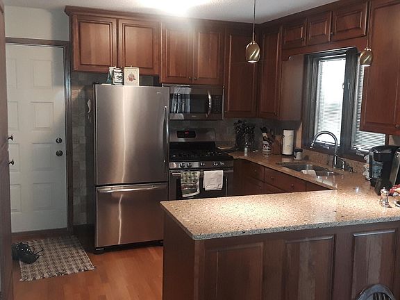 Kitchen remodeled in 2007 with cherry cabinets and quartz counter tops