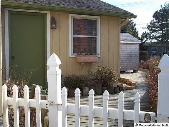 Side yard with door to garage