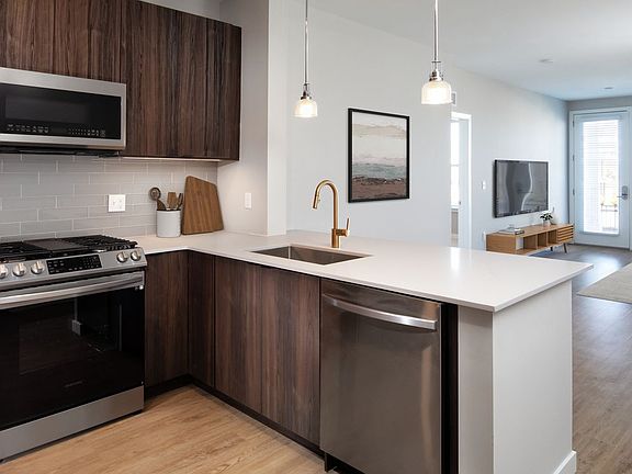 Scheme 2 Kitchen, living, and dining areas with hard surface flooring throughout