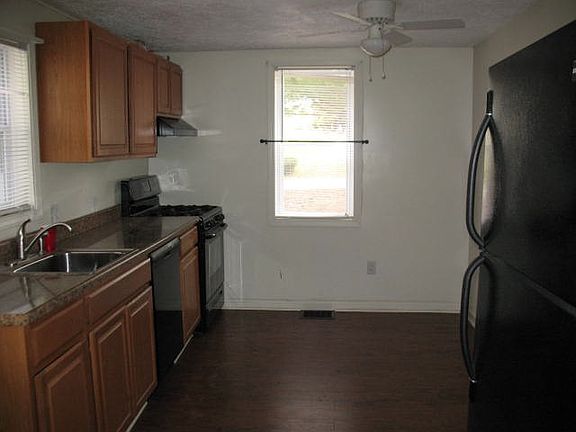 Kitchen with stove, frig, dishwasher