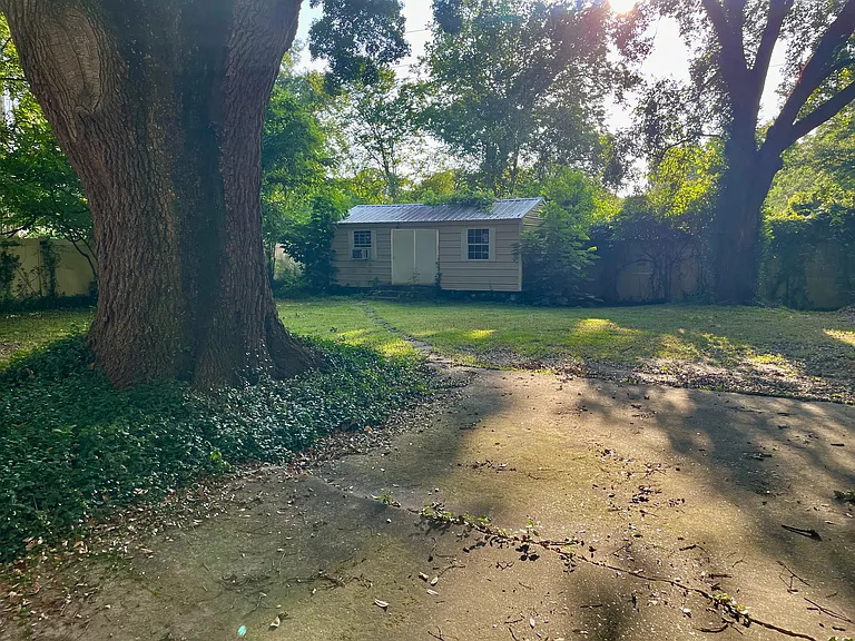 Huge fenced in back yard with complete privacy that is perfect for pets, kids and relaxation. There is a large storage shed for bike storage, projects and tools. There plenty of patio space for a table and chairs.