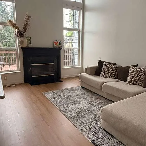 FAMILY ROOM WITH 16 FT CEILING AND WOOD BURNING FIRE PLACE