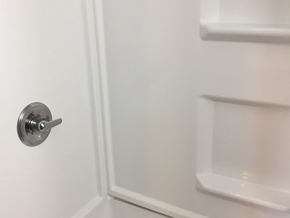 Large walk in shower with a built in seat