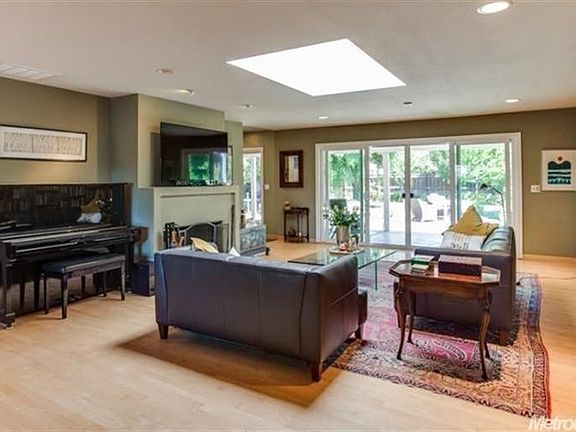 The living room slider offers views and access to the covered patio and inviting backyard.