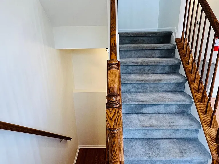 Stairs to Garage / Entrance down and to Loft and Bedrooms Up