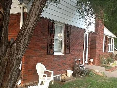Never paint this beautiful all brick house. Even trim and dormer