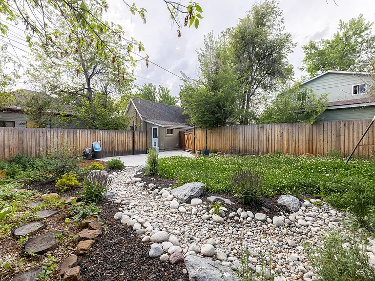 dry creek bed with native plants