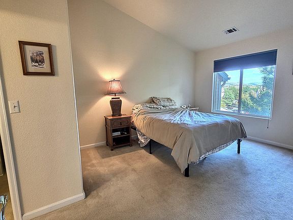 Picture of the master bedroom that shows the view a bit. Those ceilings slope up to 13 feet.