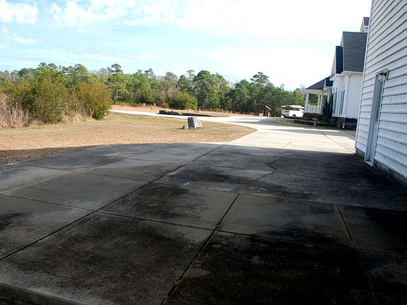 Your concrete parking area... enough for truck & compact car.