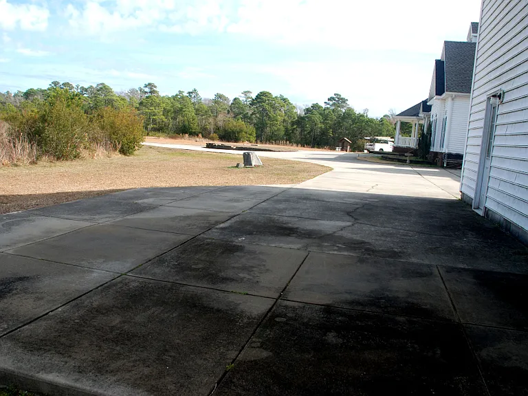 Your concrete parking area... enough for truck & compact car.