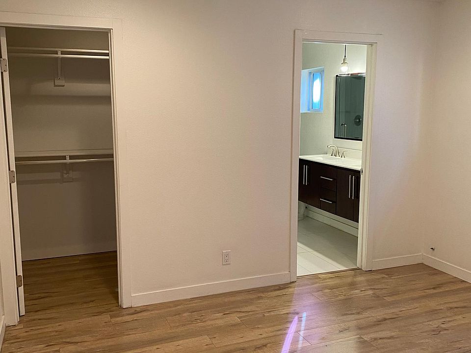 bedroom 1 with walk-in closet and ensuite bath