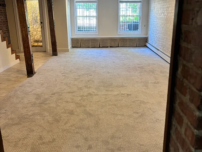 Large living space for couch, TV, office desk, gym equipment, etc.