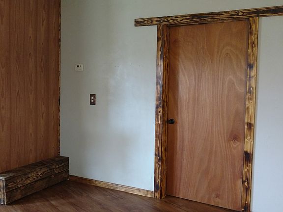 bedroom door and bench