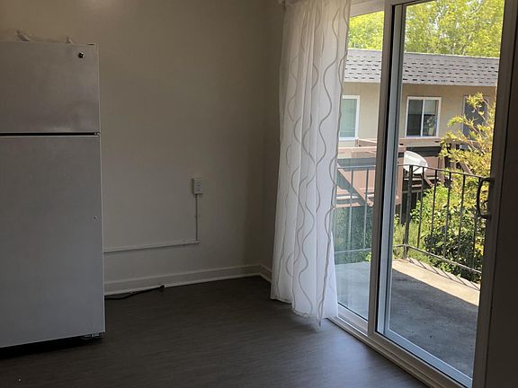 Part of kitchen with view of balcony 