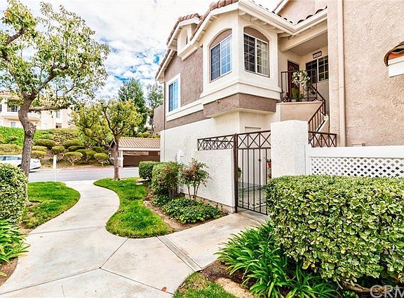 Gated entry to private courtyard area and garage access.