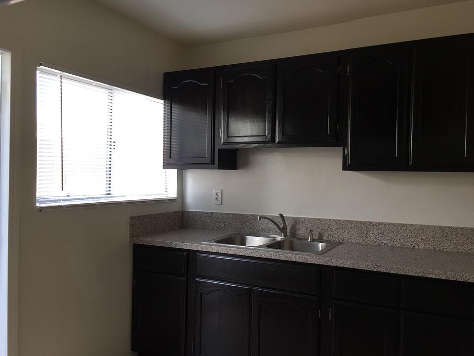 Brand new remodeled kitchen with newly installed cabinets, counter top and sink.