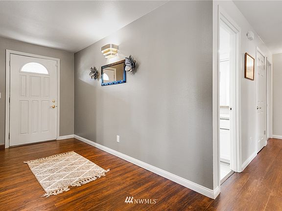 Updated with wood laminate flooring throughout.