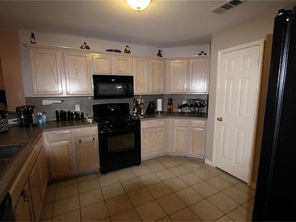 Large kitchen w/wrap around counter.  All appliances are staying! Spacious pantry.