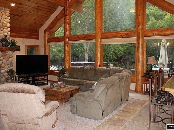 Logs surround the oversized windows for a breathe taking view.