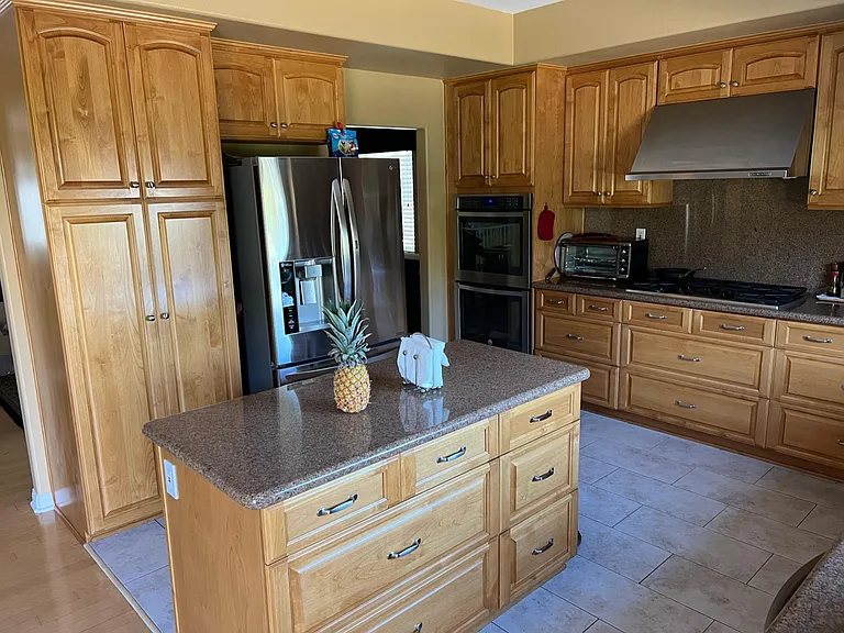 Stainless appliances, double ovens, fridge optional