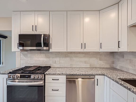 New kitchen with stainless steel appliances