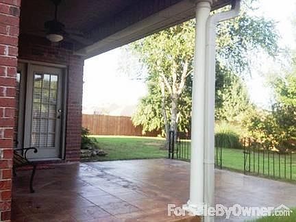 Rear Patio
						:
						Stained & scored concrete patio w/ ceiling fan. Enjoy park-like setting!