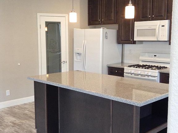 Nice lighting with Granite counter and Island