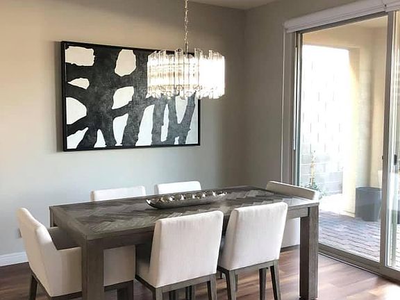Room for a 6-8' dining table. Chandelier included.