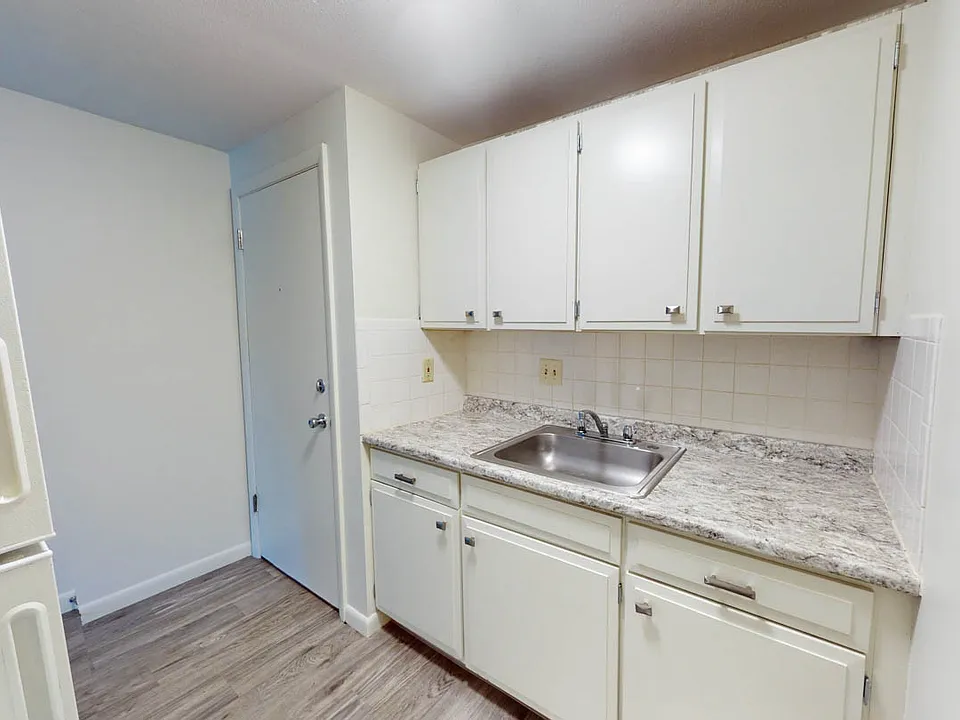 Studio -Kitchen- modern cabinets with sleek hardware and luxury vinyl floor
