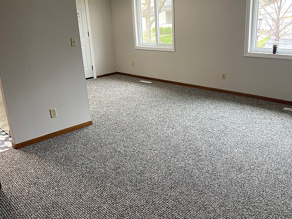Living room with brand new carpet and paint!